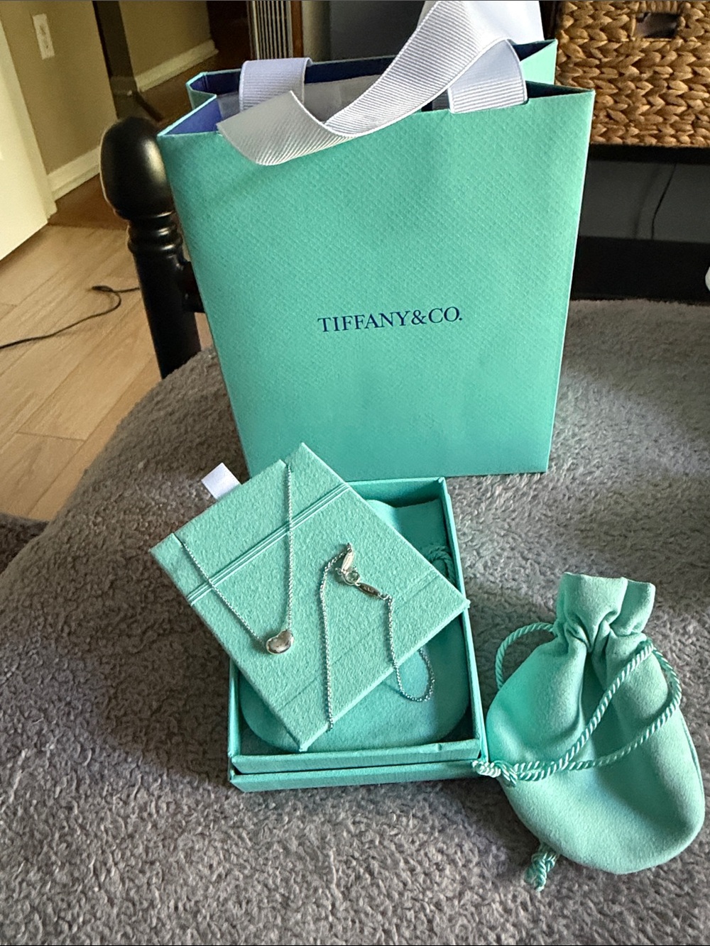 Tiffany & Co. sterling silver teardrop pendant with signature blue packaging